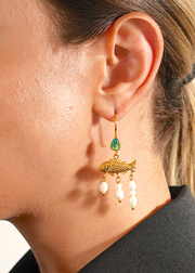 Golden Ocean Drop Earrings on a person.