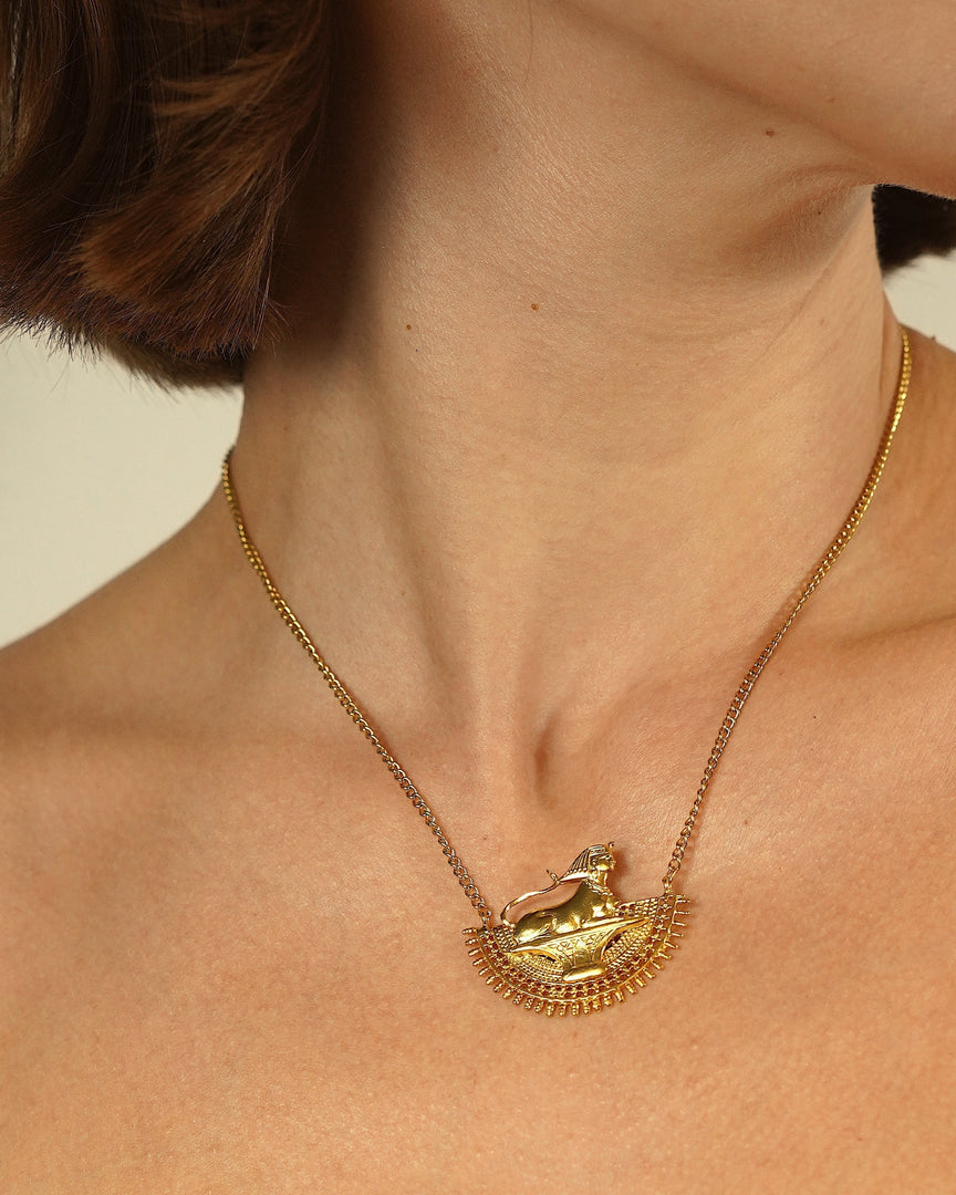 Egyptian Ancient Necklace with intricate detailing and symbolic motifs worn around the neck.